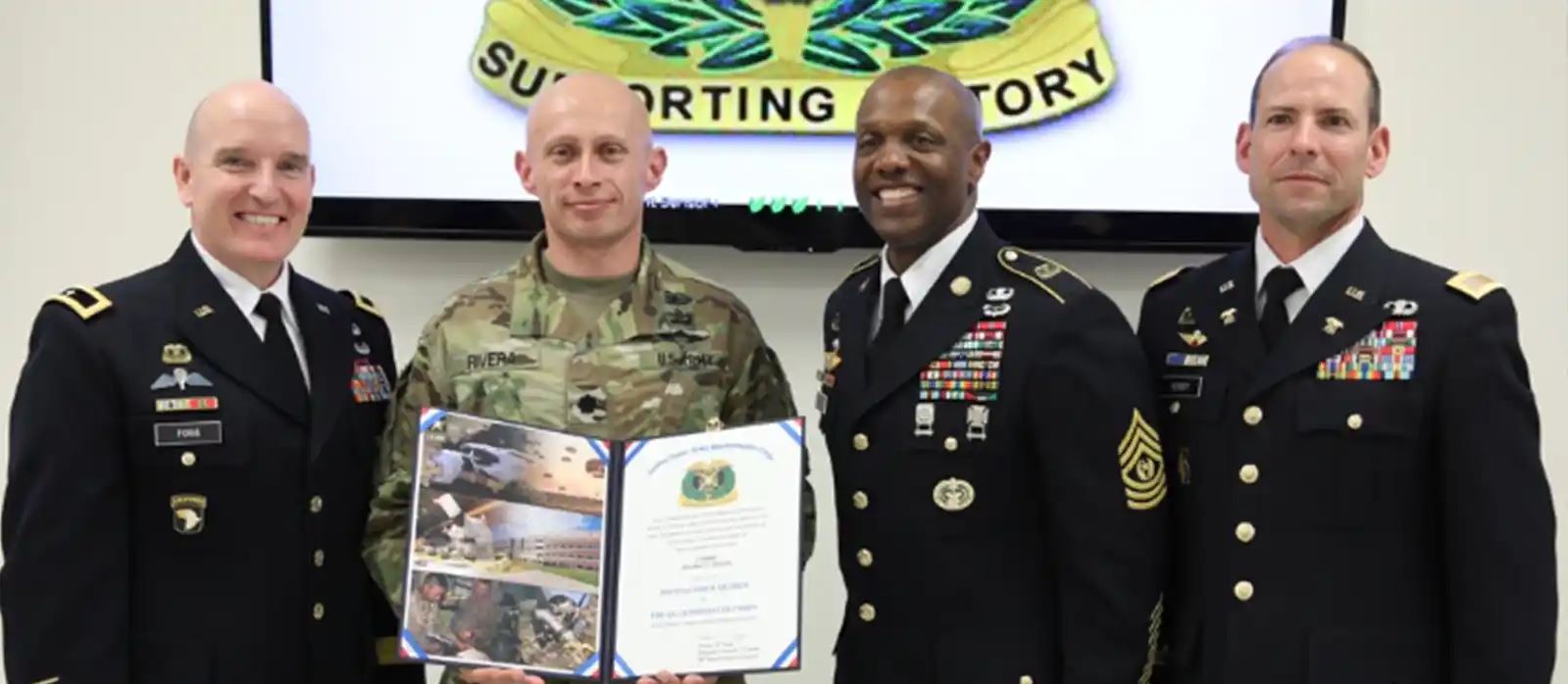 Solider receiving the Distinguished Members of the Corps award.