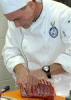 Image of a competitor cutting lamb chops