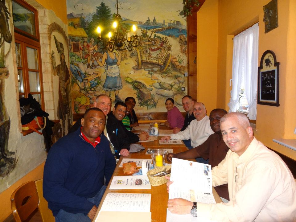 Photo of The Army Food Advisor's Corner gathered around a table.